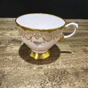 Elegant Gold and White Teacup